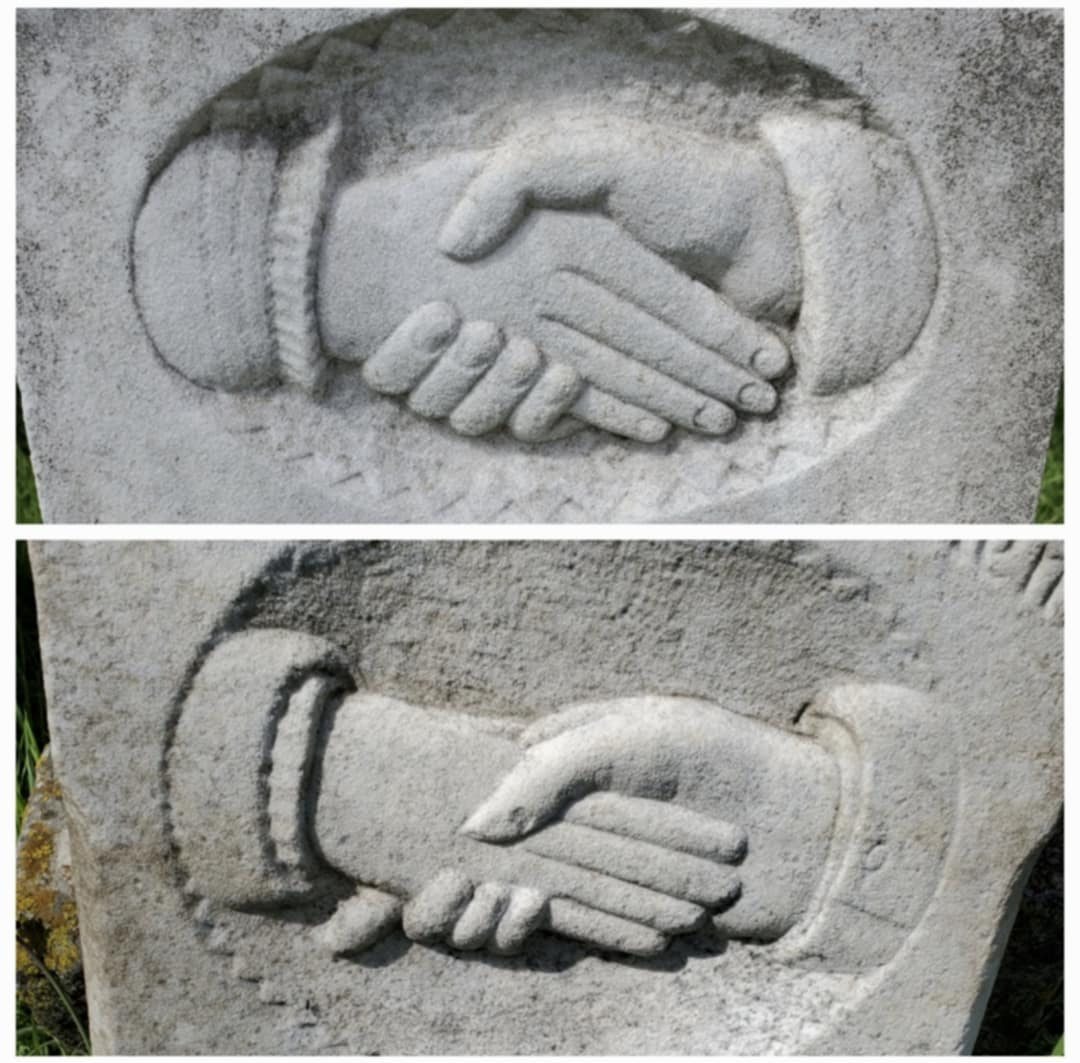 Clasped hands carved on a headstone at Western Heights Cemetery